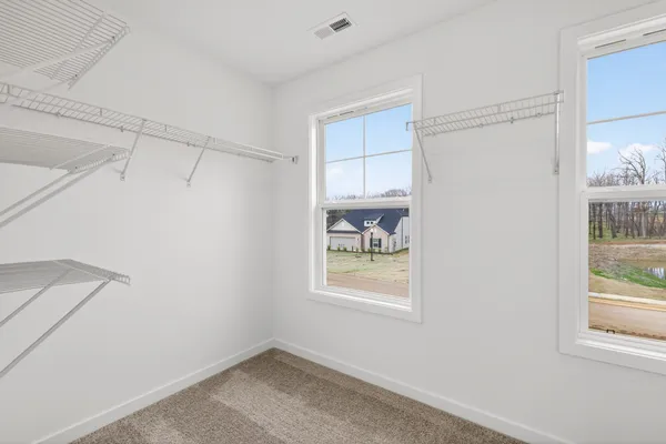a bathroom with a window and vanity