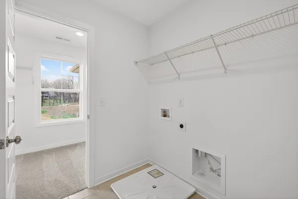 a view of an empty room and a window