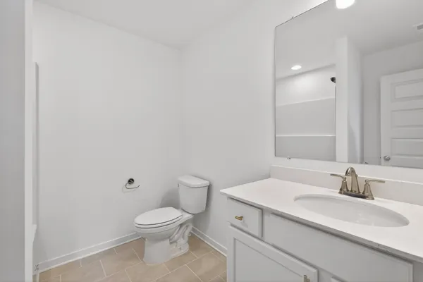 a view of a hallway with white doors