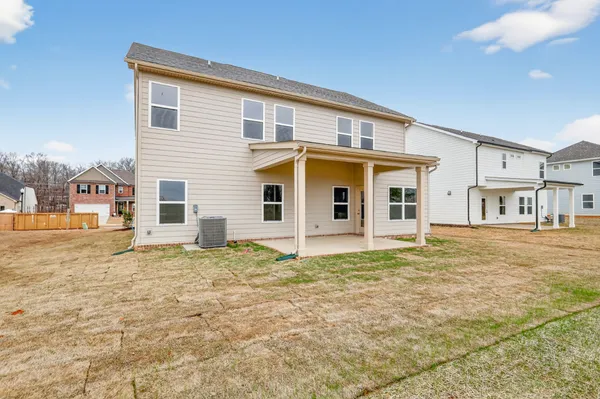 a view of a house with backyard