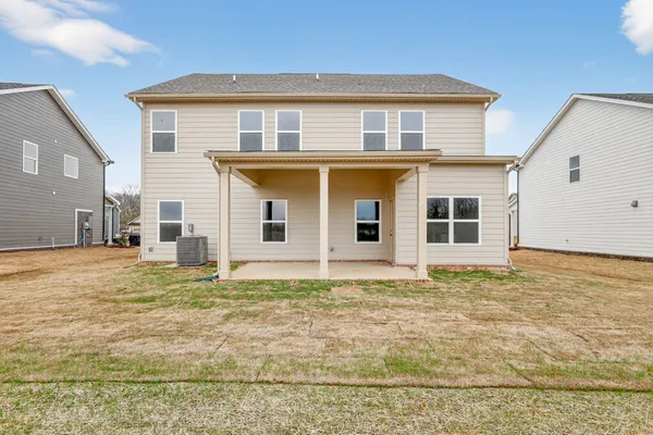 a view of a room with yard from balcony