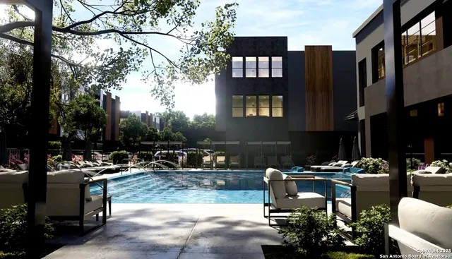 a swimming pool view with a outdoor seating