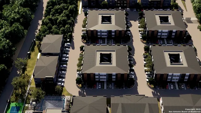 an aerial view of a house with a yard