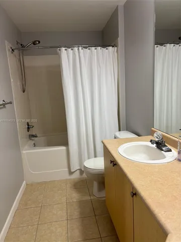 a bathroom with a sink a toilet and a bathtub
