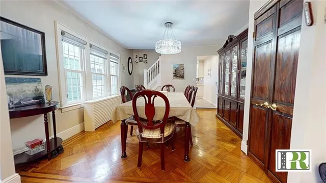 a view of a livingroom with furniture window and wooden floor