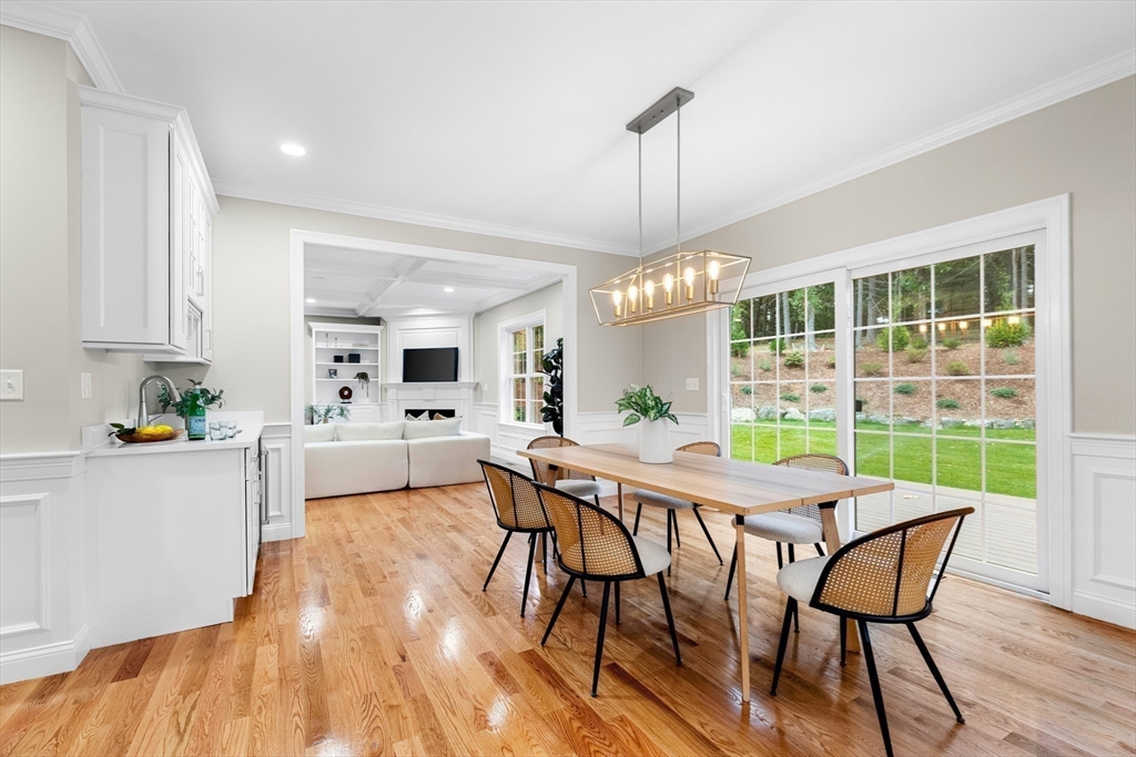 345 Grove Street Reading, MA 01867 - Photo 10 of 42 a view of a dining room with furniture window and wooden floor