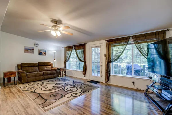 a living room with furniture and a flat screen tv