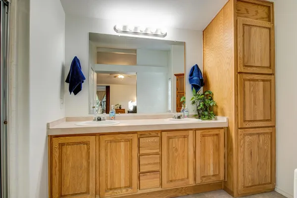 a view of a field with trees in the background