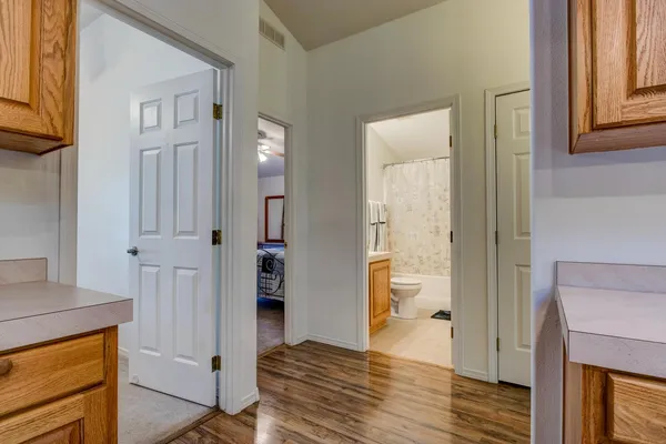 a view of balcony with wooden floor and fence
