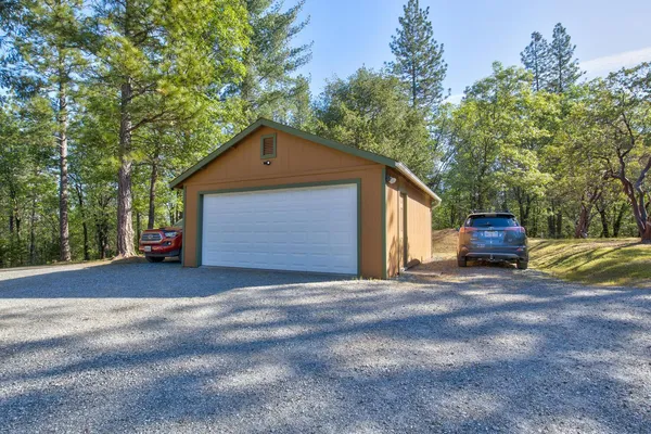 a kitchen with stainless steel appliances granite countertop a refrigerator and a stove