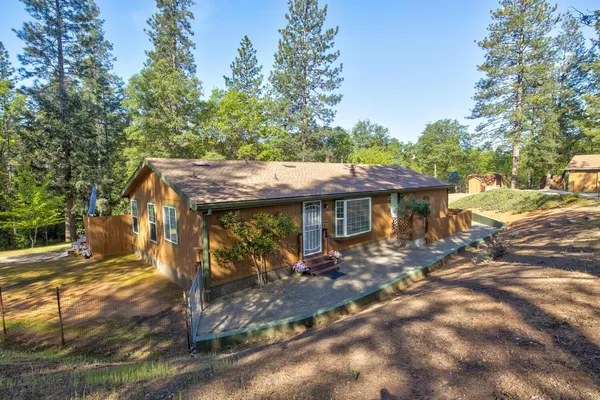 a bathroom with a tub a sink and a large mirror