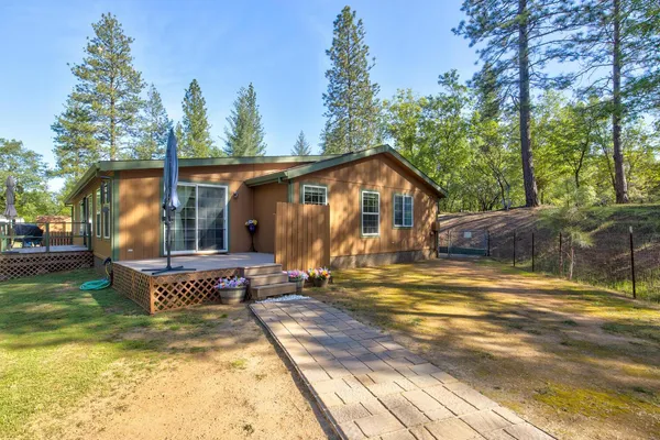 a bathroom with a bathtub a mirror and a sink