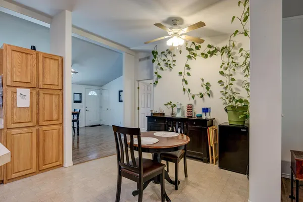 a kitchen with stainless steel appliances a refrigerator and a stove top oven