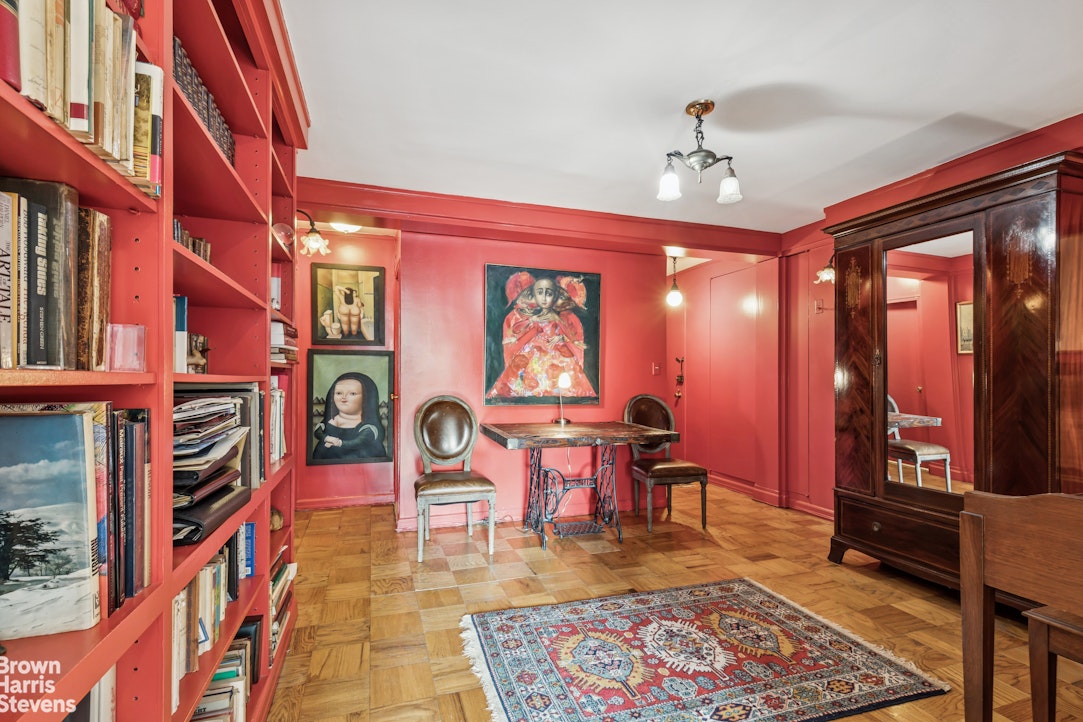 305 East 40th Street, Unit 4J Manhattan, NY 10016 - Photo 10 of 17 a living room with furniture a rug and a chandelier