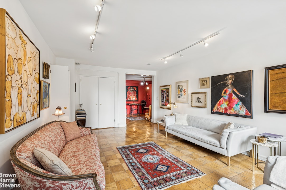 305 East 40th Street, Unit 4J Manhattan, NY 10016 - Photo 4 of 17 a living room with furniture and a rug