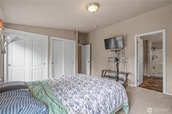 a bathroom with a shower a toilet and a sink