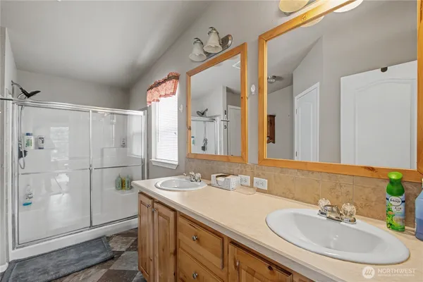 a view of a house with a yard and garage