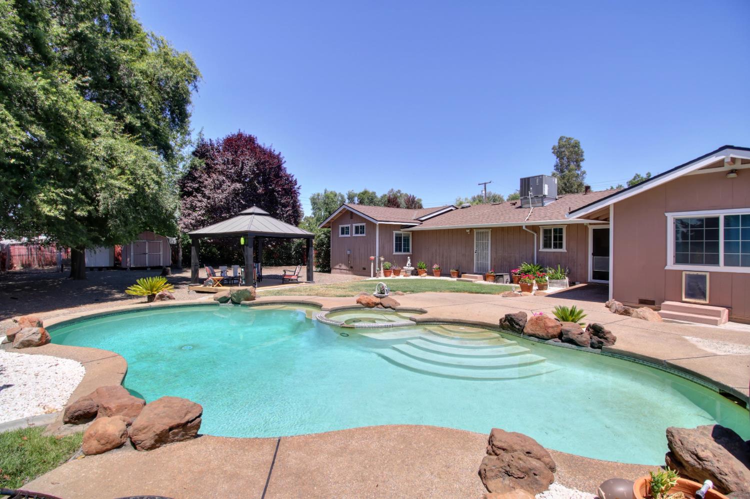11384 Colony Road Wilton, CA 95693 - Photo 1 of 1 a front view of a house with swimming pool garden and patio