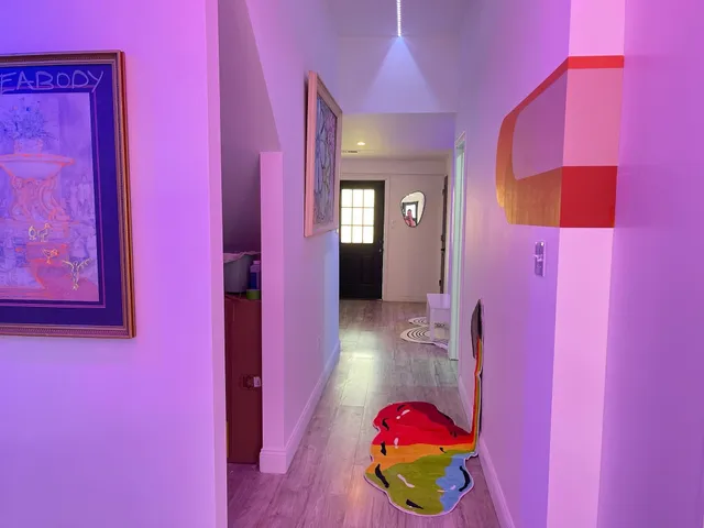 a bathroom with a bath tub a sink and a mirror