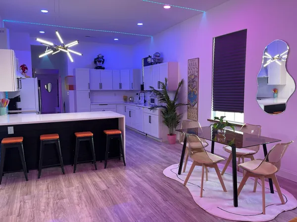 a dining room with furniture and window