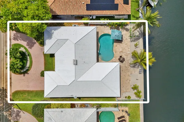 an aerial view of residential houses with outdoor space