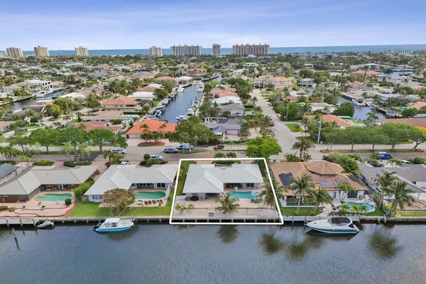 an aerial view of residential houses with outdoor space