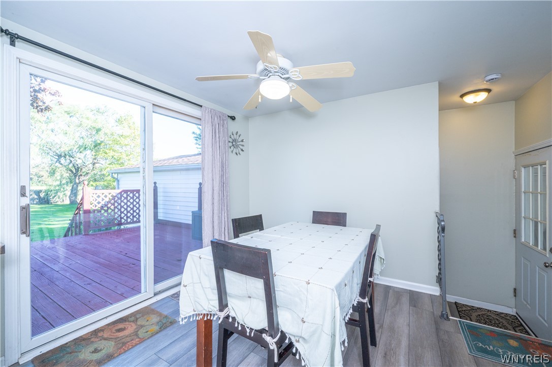 6463 Ward Road Sanborn, NY 14132 - Photo 21 of 49 Sliding glass doors open from the dining space directly to the backyard deck.