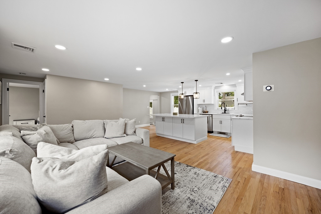 24 Francis Road Sharon, MA 02067 - Photo 11 of 41 a living room with furniture kitchen view and a wooden floor