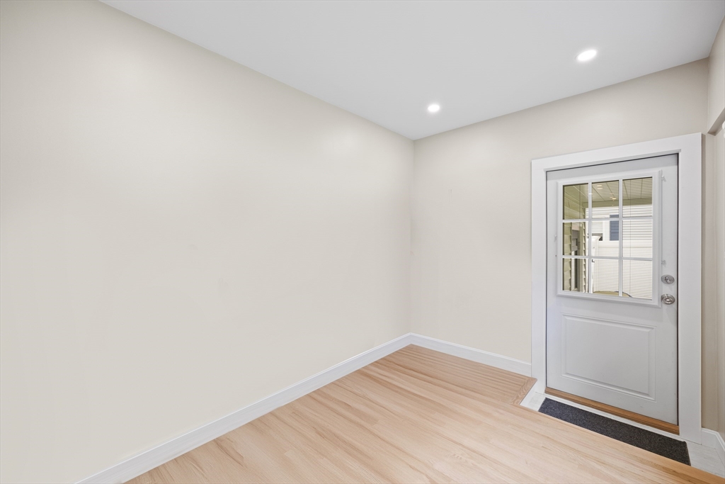 24 Francis Road Sharon, MA 02067 - Photo 18 of 41 an empty room with wooden floor and mirror