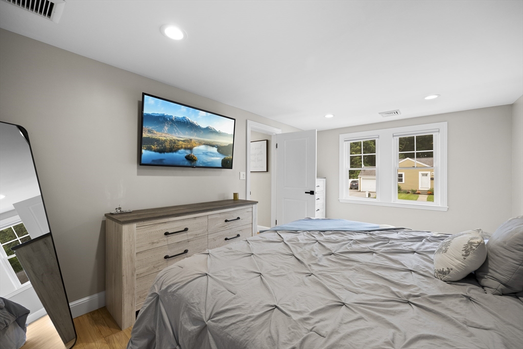 24 Francis Road Sharon, MA 02067 - Photo 20 of 41 a bedroom with a bed and a flat screen tv
