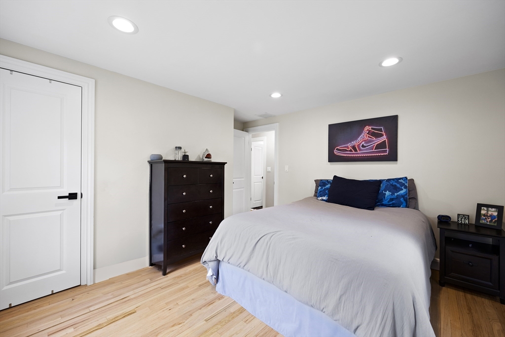 24 Francis Road Sharon, MA 02067 - Photo 25 of 41 a bedroom with a bed and a dresser