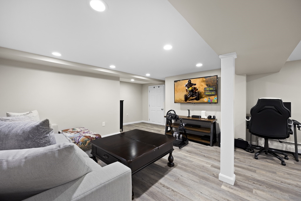 24 Francis Road Sharon, MA 02067 - Photo 30 of 41 a living room with furniture and a flat screen tv