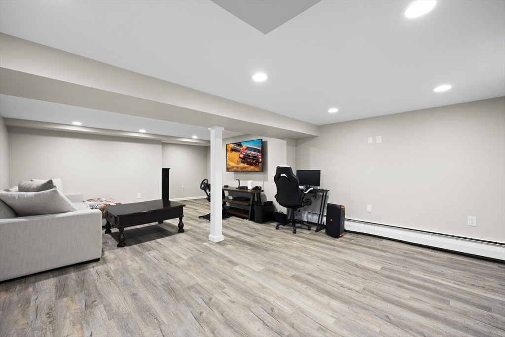 24 Francis Road Sharon, MA 02067 - Photo 34 of 41 a living room with furniture and a wooden floor