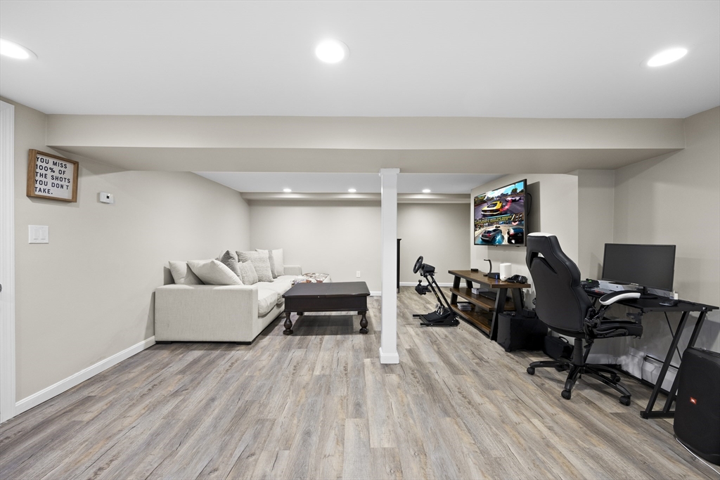 24 Francis Road Sharon, MA 02067 - Photo 35 of 41 a living room with furniture and a wooden floor