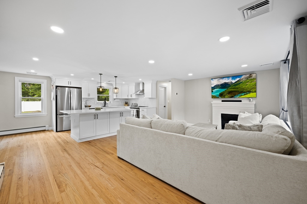 24 Francis Road Sharon, MA 02067 - Photo 6 of 41 a living room with furniture and a wooden floor