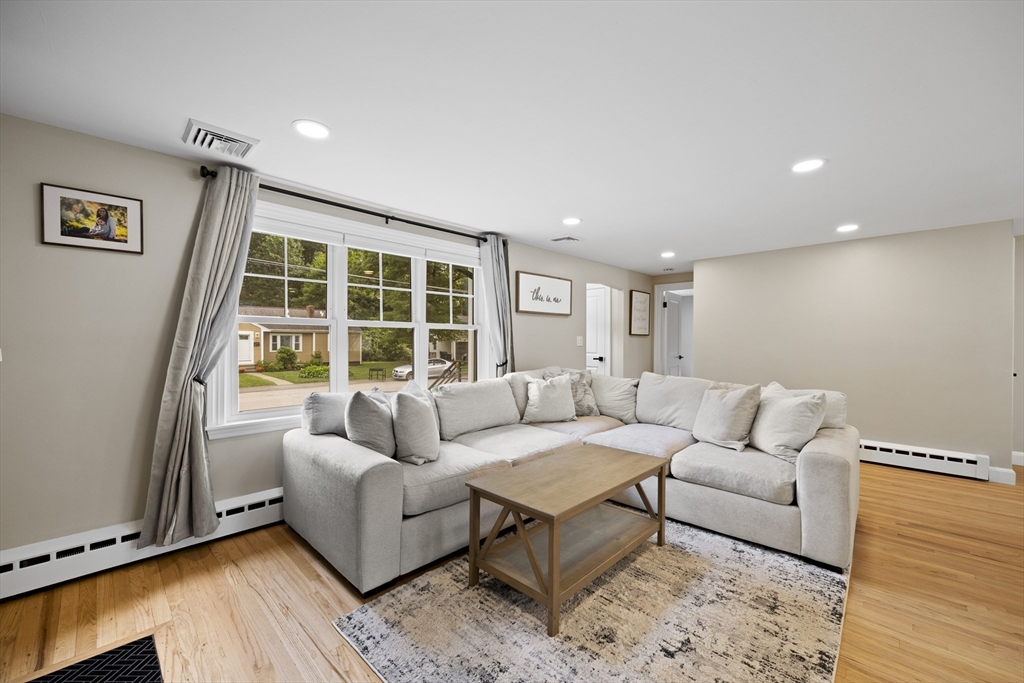 24 Francis Road Sharon, MA 02067 - Photo 10 of 41 a living room with furniture and a large window