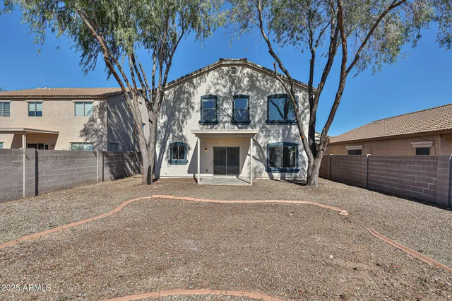 a view of a house with a yard and garage