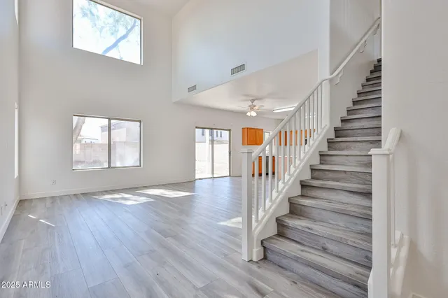 a view of an entryway with wooden floor