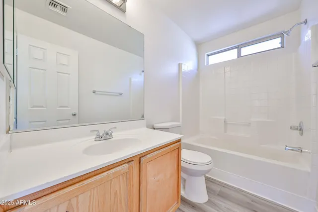 a bathroom with a sink a toilet and a bathtub