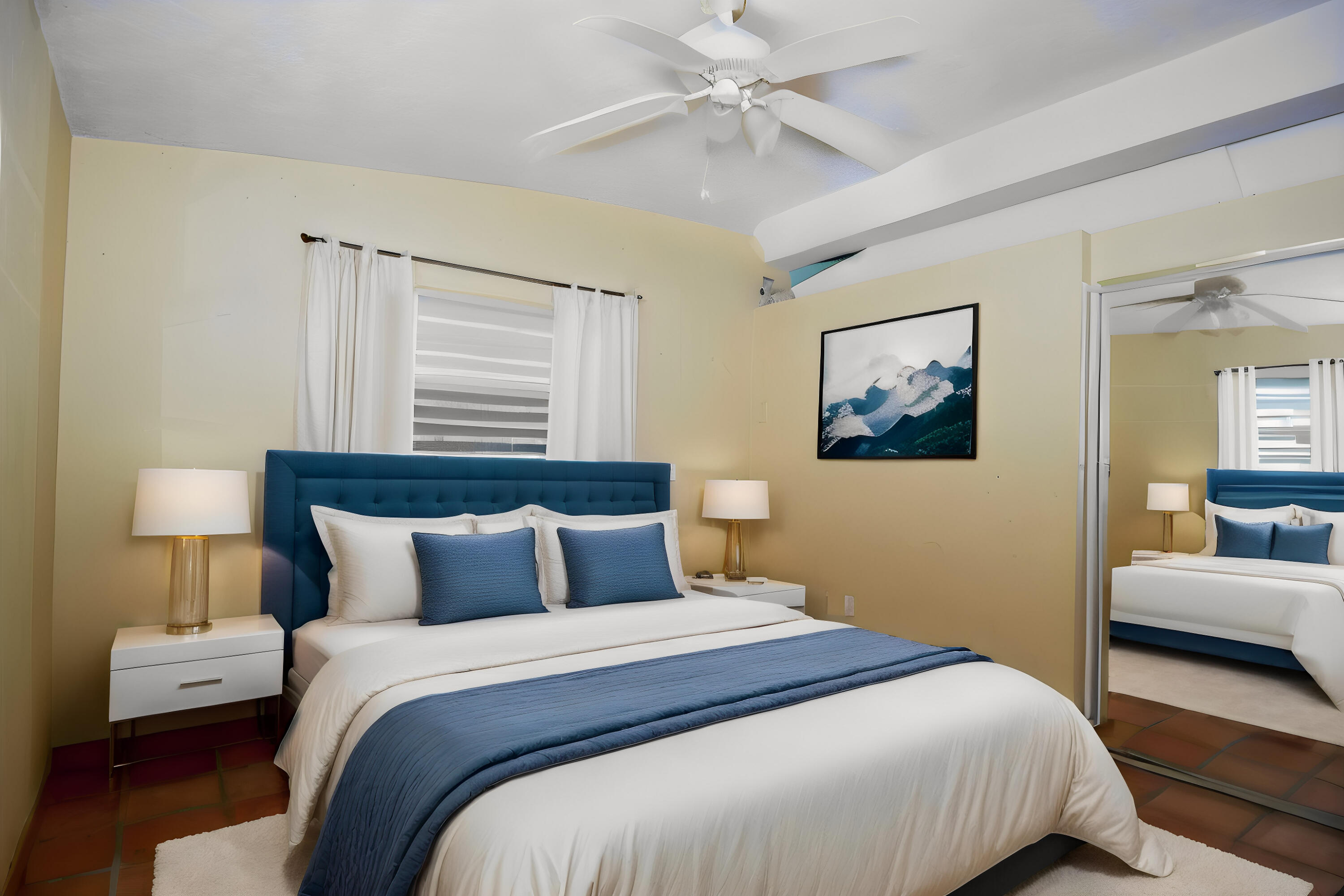 60 Southeast Marlin Avenue Key Largo, FL 33037 - Photo 22 of 46 a bedroom with a bed and a chandelier