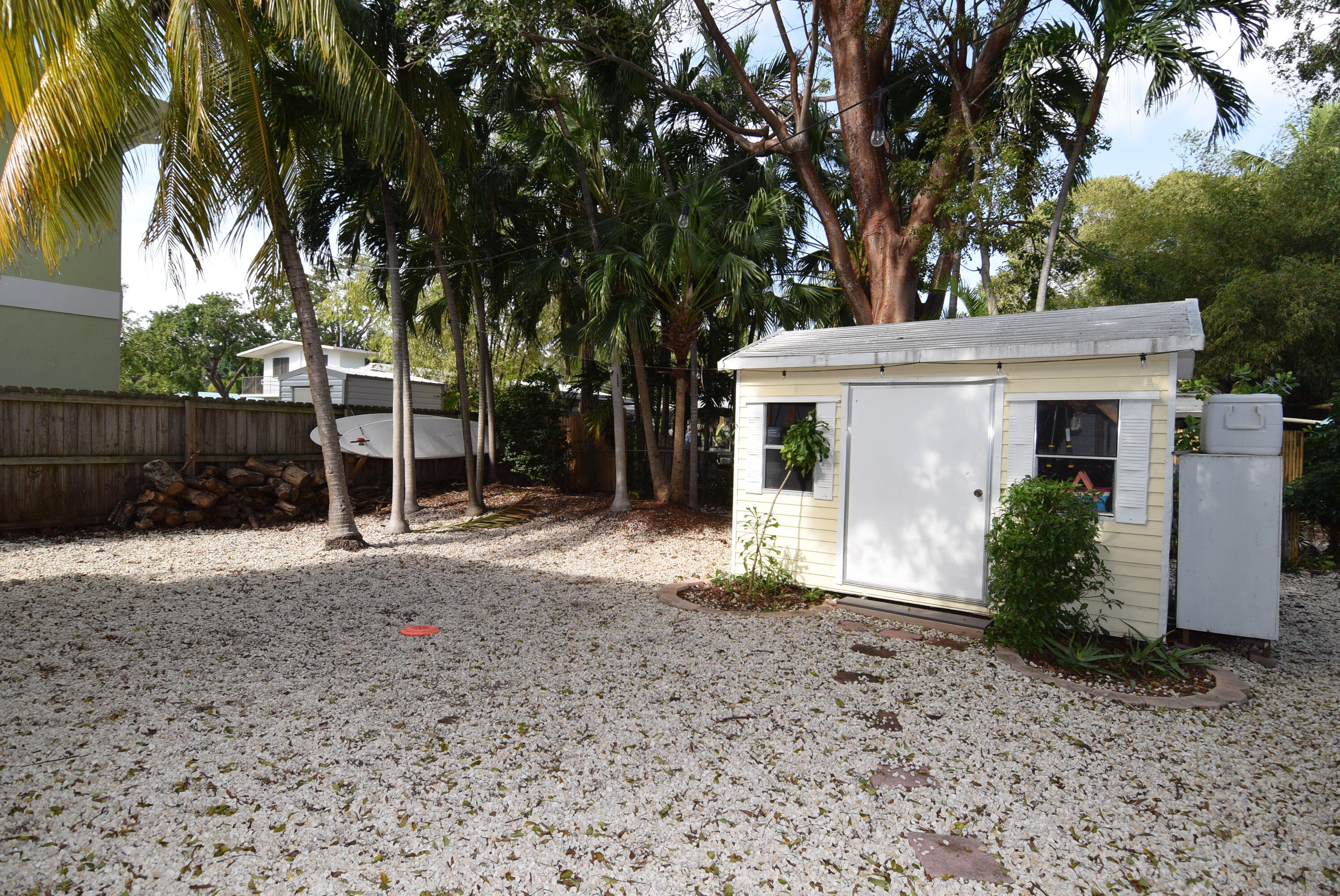60 Southeast Marlin Avenue Key Largo, FL 33037 - Photo 28 of 46 a view of a house with a backyard and a tree