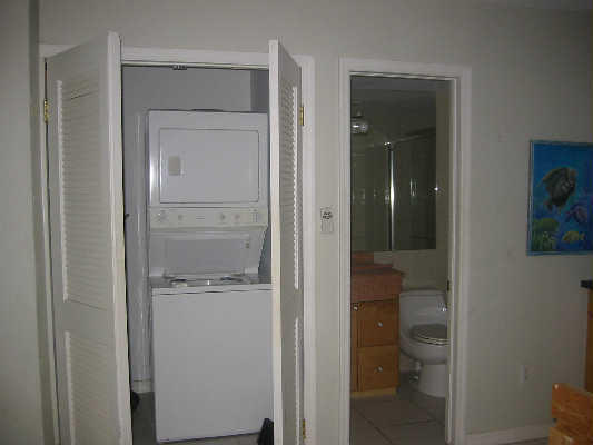 60 Southeast Marlin Avenue Key Largo, FL 33037 - Photo 36 of 46 a bathroom with a glass shower door