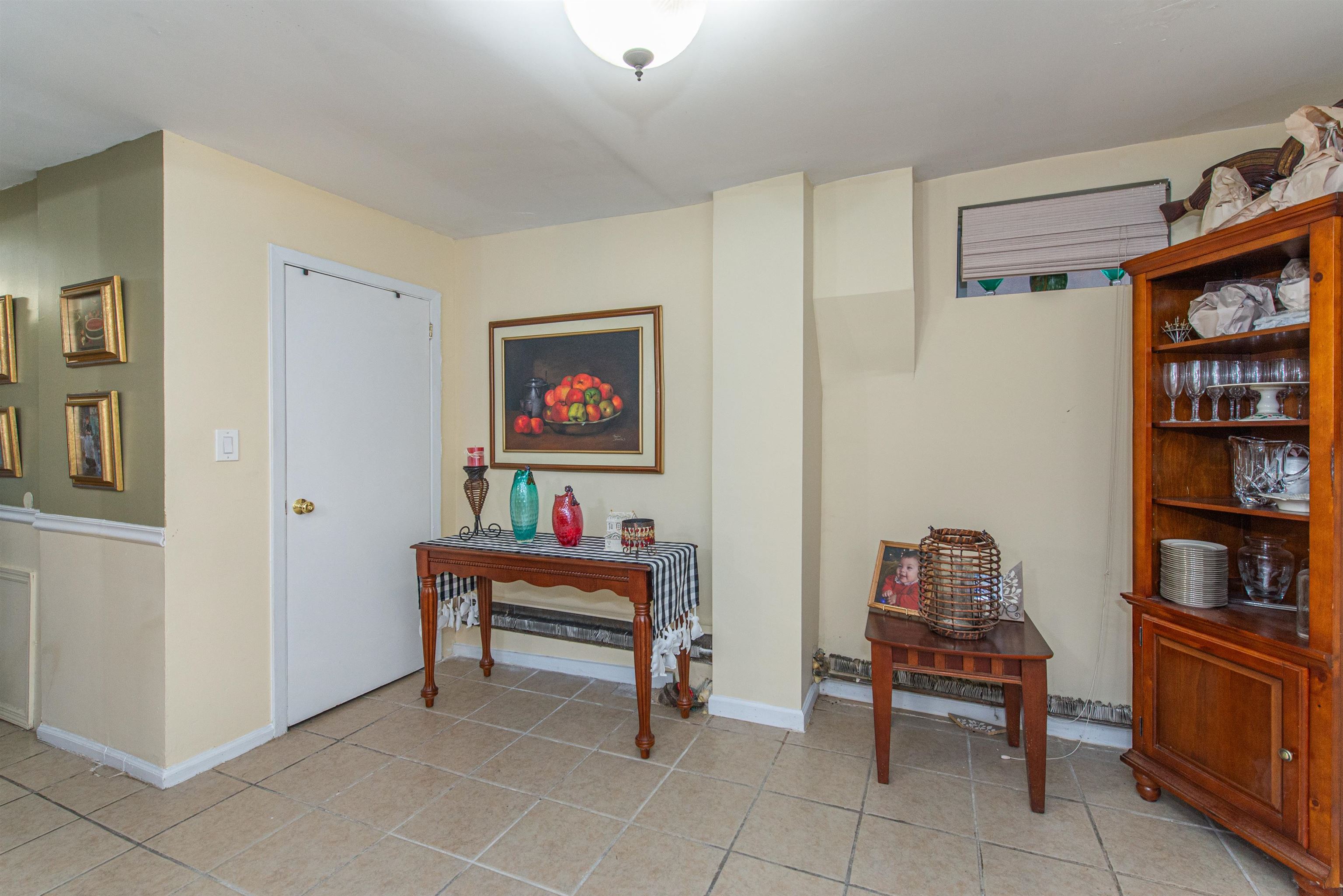 413 24th Street Union City, NJ 07087 - Photo 14 of 19 a room with furniture and book shelf
