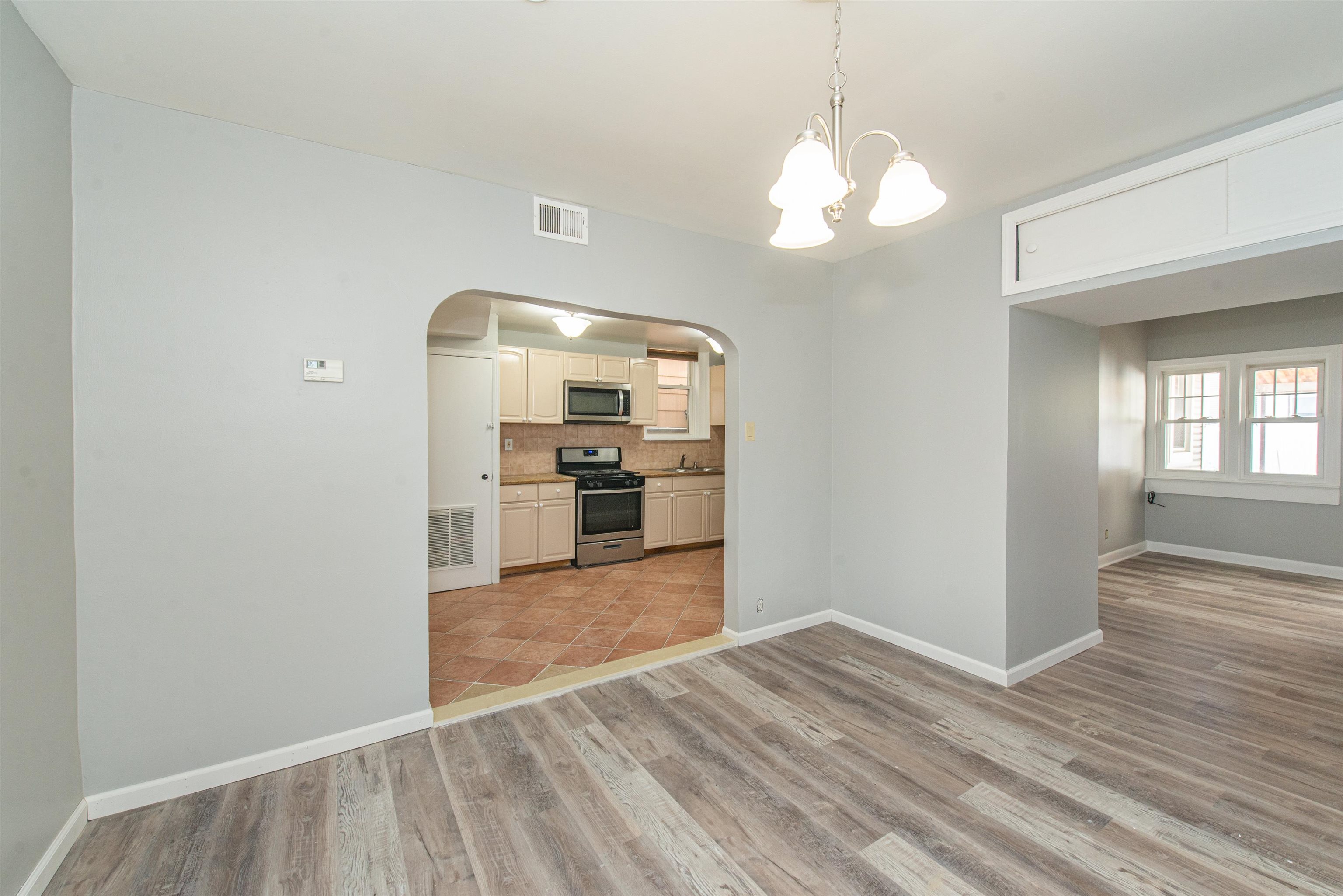 413 24th Street Union City, NJ 07087 - Photo 5 of 19 a view of a kitchen with cabinets and stainless steel appliances