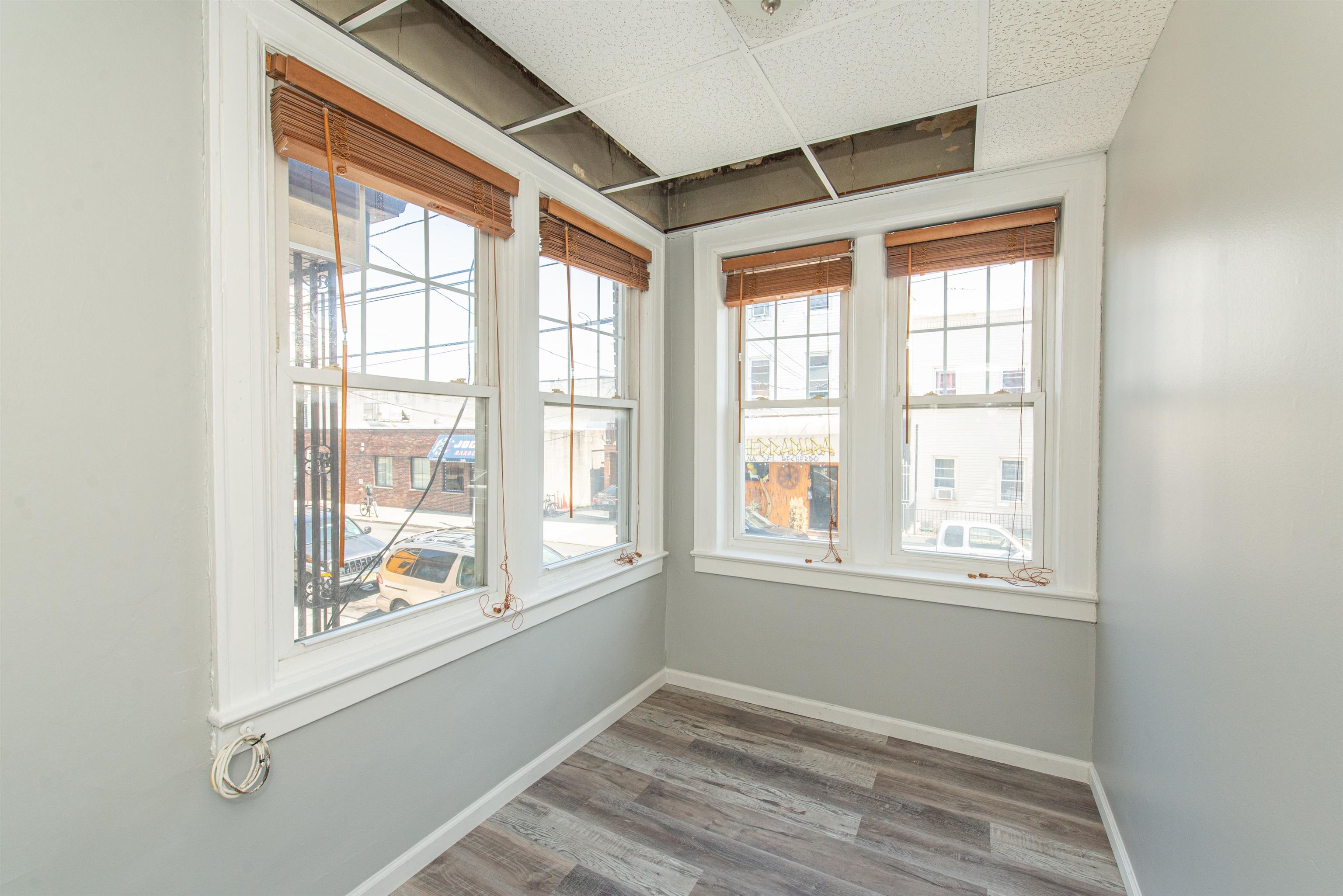 413 24th Street Union City, NJ 07087 - Photo 6 of 19 an empty room with windows