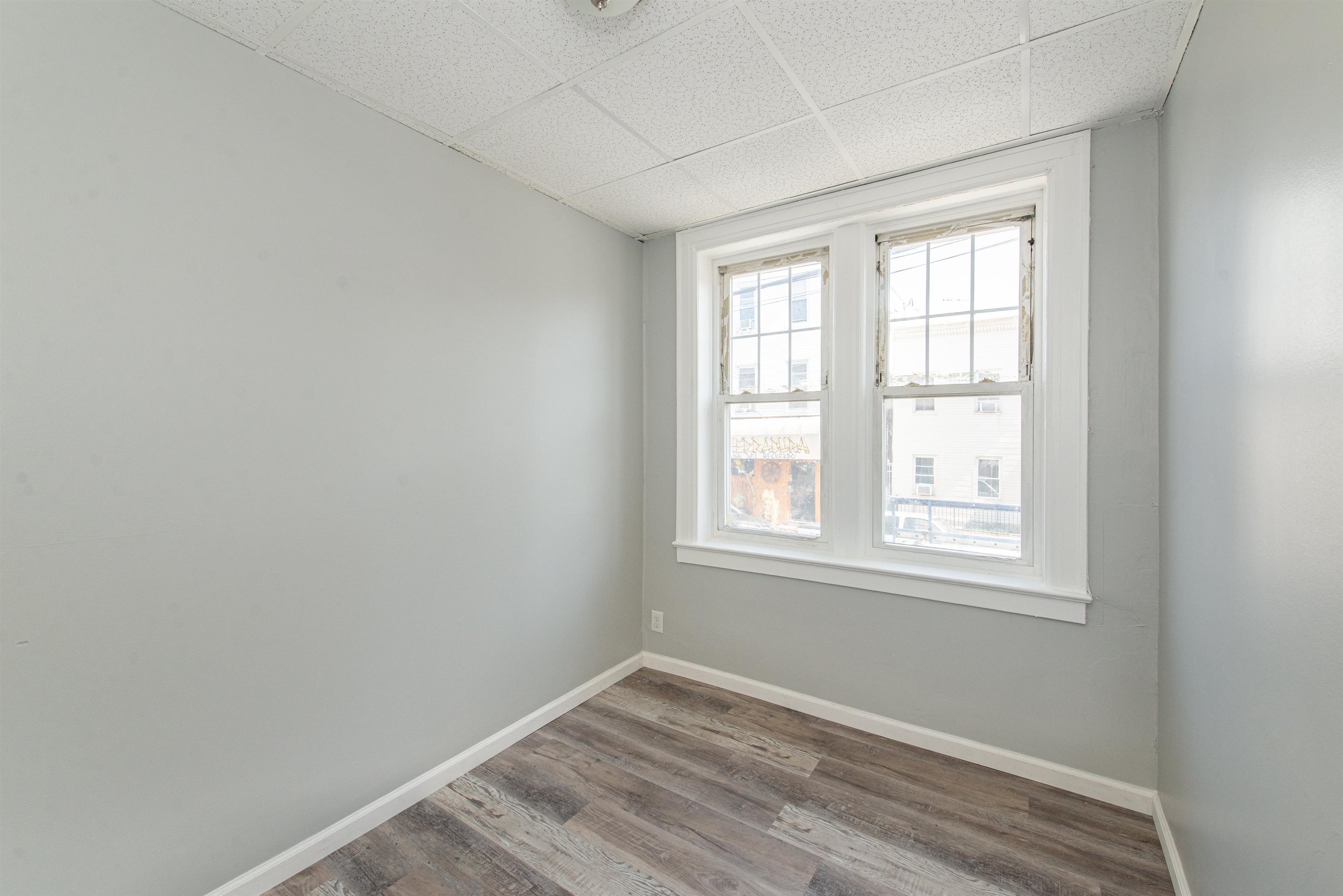 413 24th Street Union City, NJ 07087 - Photo 8 of 19 an empty room with a window