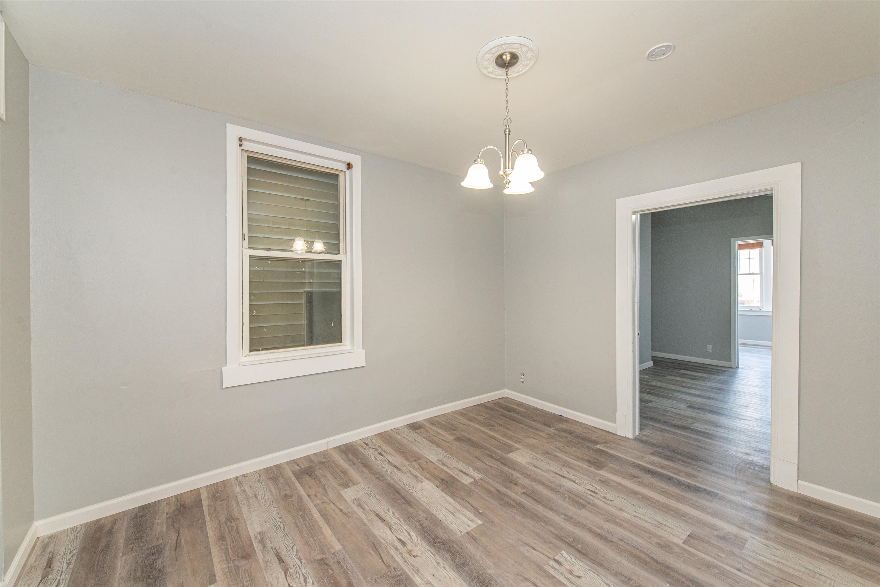 413 24th Street Union City, NJ 07087 - Photo 9 of 19 a view of empty room with wooden floor