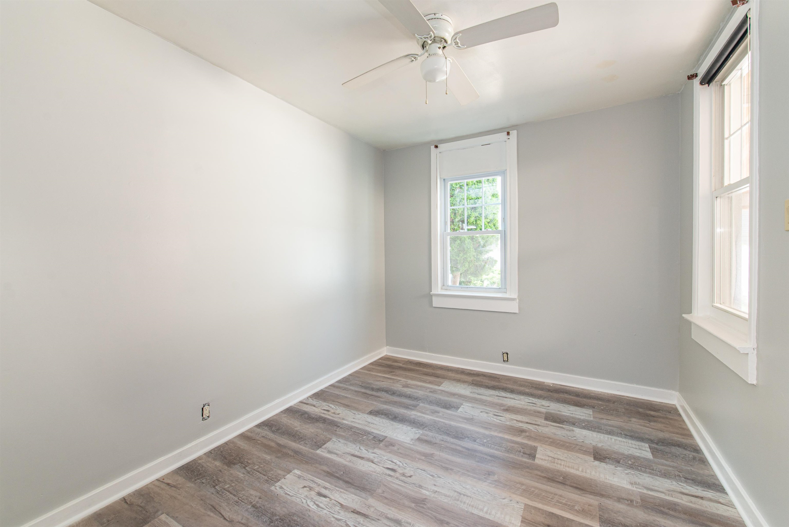 413 24th Street Union City, NJ 07087 - Photo 10 of 19 wooden floor in an empty room with a window
