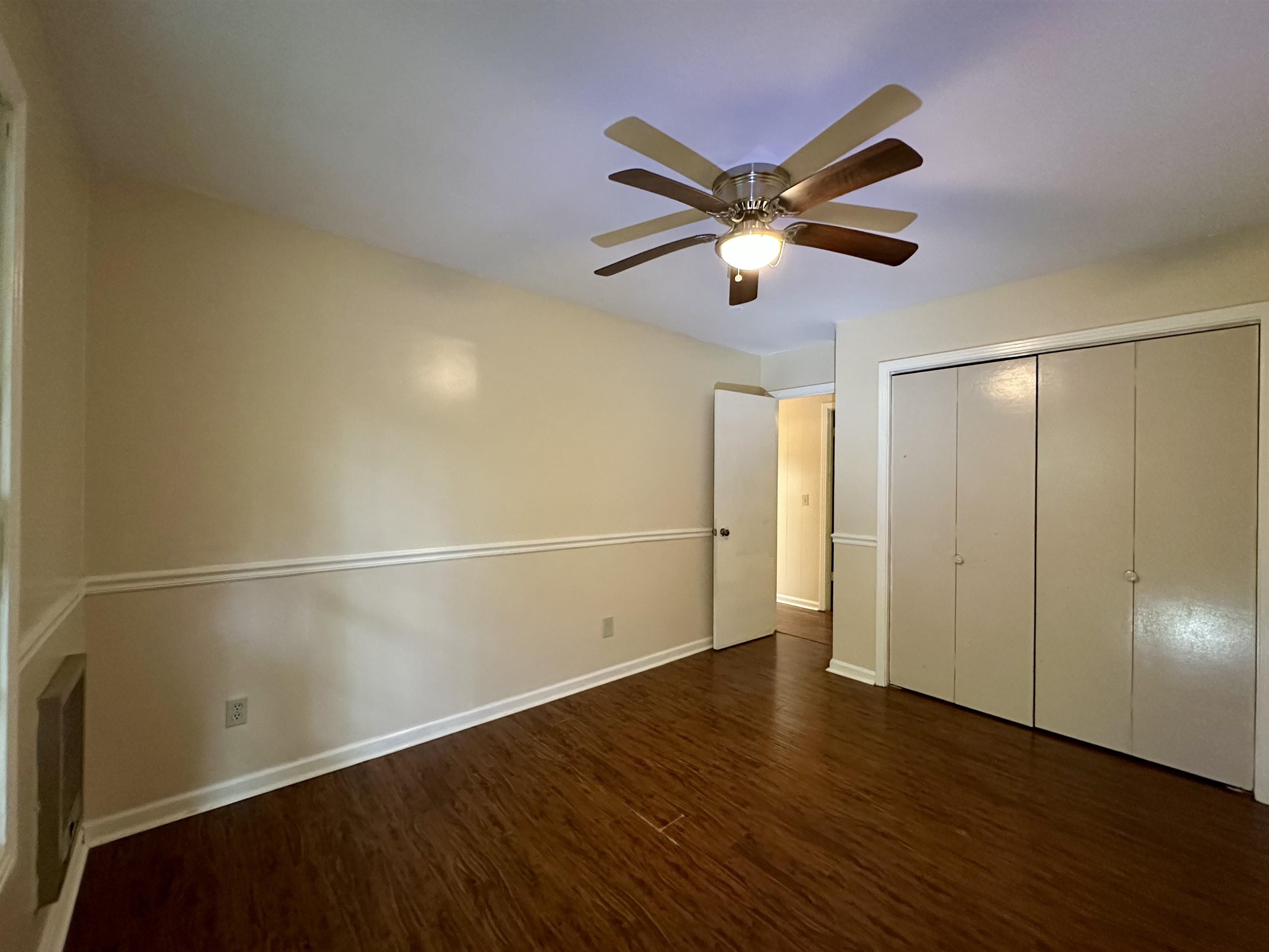 1790 Country Club Road Somerville, TN 38068 - Photo 17 of 38 Unfurnished bedroom with wood finished floors, a closet, and a ceiling fan