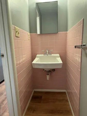 a bathroom with a sink and mirror